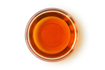 Sesame oil in glass bowl on white background