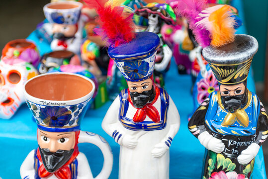 Colorful ceramic chinelo figures. Mexican crafts.