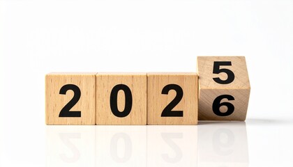 Wooden blocks flipping from 2025 to 2026.
