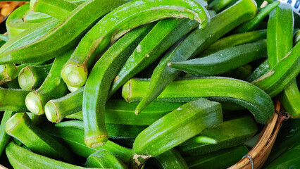 Healthy okra pods in a basket