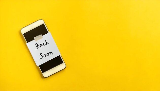 Mobile smartphone on copy space yellow background with note written Back Soon - Taking a break or switch off from social media, Offline disengage or deactivation, to detox and improve mental health