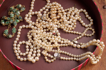 Pearl necklaces in a round box