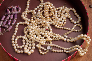 Pearl necklaces in a round box