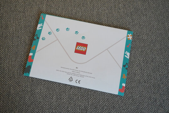 LEGO envelope with paw prints and logo on a gray surface