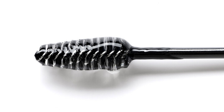 Close-up photo of Essence serum gel for eyebrows and eyelashes on a brush