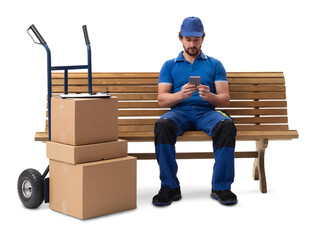 A delivery courier sitting on a bench with a hand cart of parcels, using a smartphone, isolated on a white background.