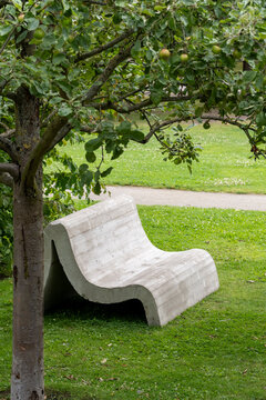 Sculptural bench architecture with trees, greenery, park design and urban elements creating a contemporary public space in HafenCity Hamburg Germany
