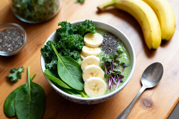 Detox Smoothie Bowl with Kale, Spinach, Banana, Chia Seeds and Fresh Microgreens for Clean Eating, Superfood Nutrition and Healthy Morning Energy Boost