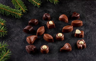chocolate pralines and hazelnuts with christmas decoration