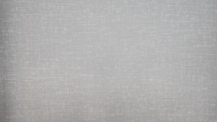 Luxurious grey fabric wall texture. Close-up of grey linen fabric horizontally mounted on a wall. Hotel walls decorated with fabric. Fabric walls are ideal for use as a background.
