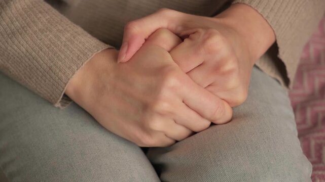 Hands with anxiety and finger stress at home, mental health tension and depression signs, psychology fear. Person picking nails from shame in living room, grief trauma, guilt feelings or deep worries