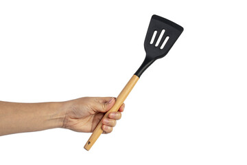Hand holding kitchen utensils on transparent background