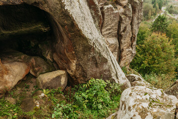 Rocky cliffs and green mountain landscape in the Ukrainian Carpathians &mdash; natural sandstone formations and forest view