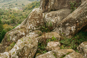 Rocky cliffs and green mountain landscape in the Ukrainian Carpathians — natural sandstone formations and forest view