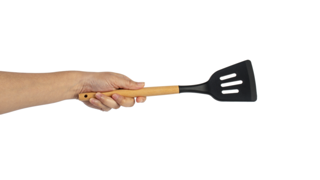 Hand holding kitchen utensils on transparent background