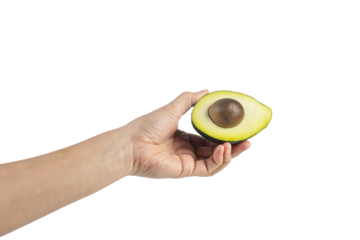 whole and half avocado and hand isolated on transparent background close-up.