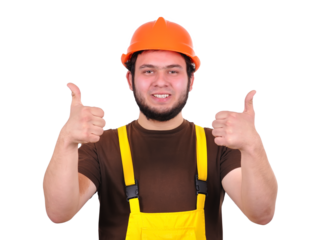 A young engineer in an orange helmet shows a thumbs up with both hands