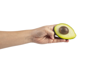 whole and half avocado and hand isolated on transparent background close-up.