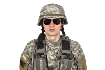 Fototapeta premium A close-up of an American soldier in camouflage uniform, wearing a helmet and black glasses.
