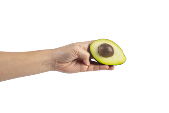 whole and half avocado and hand isolated on transparent background close-up.