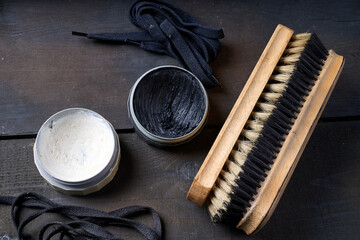 Shoe brushes on a black trunk