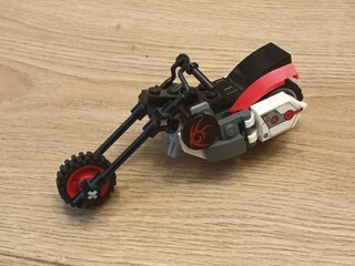 Obraz premium LEGO® Motorcycle A Cool Red and Black Chopper Building Toy on Wooden Surface