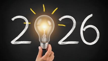 Illuminated light bulb represents new ideas and innovation for the year 2026 presented on a chalkboard background for concepts of future planning and brainstorming - Powered by Adobe