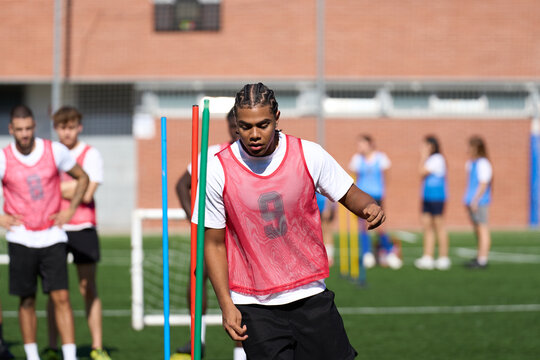 Young man doing soccer agility drills