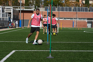 Soccer player dribbling ball during training session