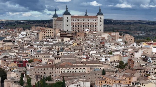 Aerial view of the imposing Alcazar of Toledo surrounded by the dense urban landscape, a captivating blend of history and architecture, Toledo, Castile-La Mancha, Spain.
