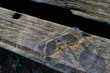 glasses and their case on wood
