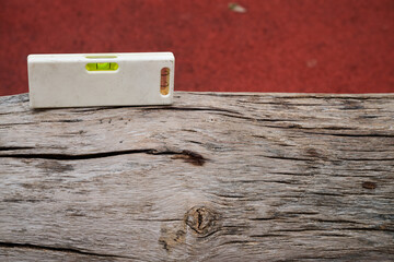 Outdoor. small spirit level on wood