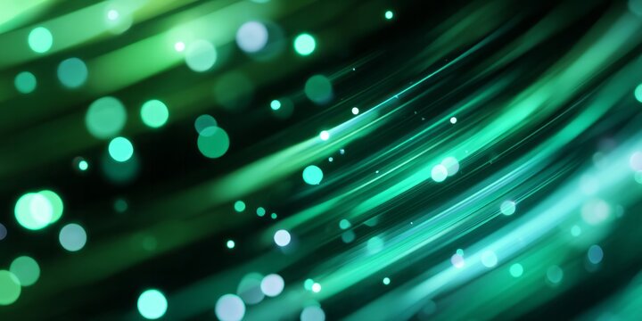 Dynamic streaks of luminous green and cyan light flow across a dark background with scattered circular highlights.