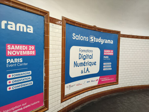 Paris, France - November 22, 2025: Colorful advertisement posters for digital training events displayed in Paris subway station, showcasing vibrant design and informative content for commuters