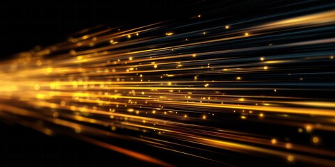 Intense golden light streaks move rapidly across a dark background creating an abstract sense of motion