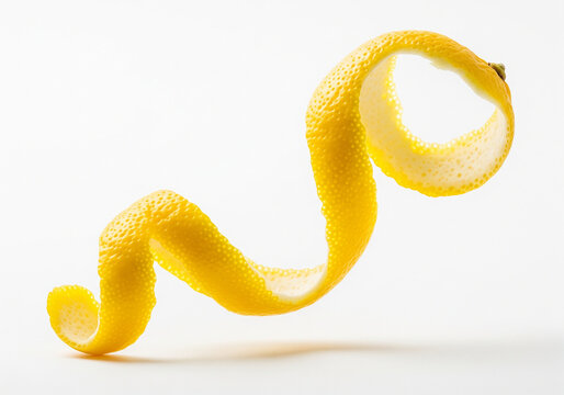 Lemon peel curl, A bright yellow citrus garnish isolated on white background - Powered by Adobe