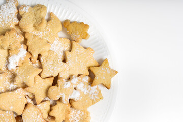 Christmas cookies made of shortbread dough in the form of figures of Christmas trees and little men