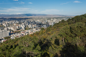 Fototapeta premium Scenic Aerial View Of Tbilisi Cityscape From Green Hillside