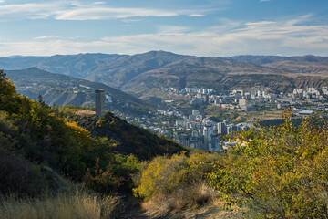 Obraz premium Scenic View Of Stone Tower On Hill Overlooking Tbilisi Cityscape