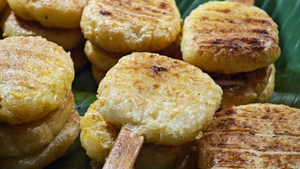 ISAN Cuisine. Grilled Sticky Rice Dipped with Egg.