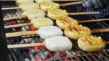 ISAN Cuisine. Grilled Sticky Rice Dipped with Egg.