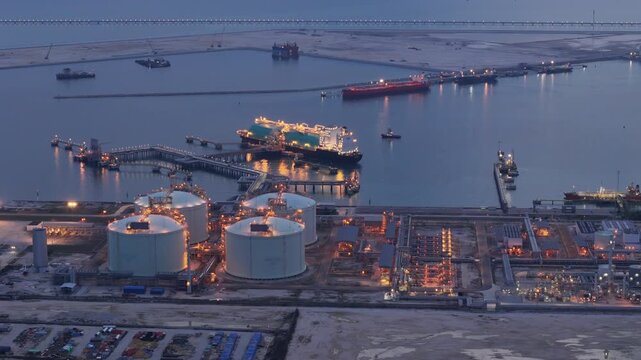 LNG (Liquified Natural Gas) tanker anchored in Gas terminal gas tanks for storage. Oil Crude Gas Tanker Ship. LPG at Tanker Bay Petroleum Chemical or Methane freighter export import transportation