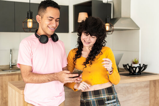 Smiling friends exploring fun social media content together in relaxed lifestyle