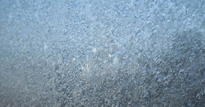 frost pattern on frozen window freezing icy glass texture abstract christmas background