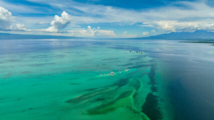 Aerial drone of Manjuyod sandbar in the turquoise water of the sea on the atoll. Negros,...