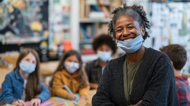 In a vibrant classroom setting, an African American teacher interacts with attentive students engaged in their work. The students focus on creativity and collaboration using their