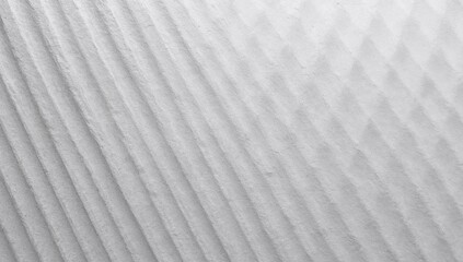Obraz premium Capturing textured ribbed surface under angled studio light, with diagonal ridges and soft shadows