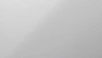 Displaying textured light-gray surface in studio close-up, showing fine grain and soft shadows