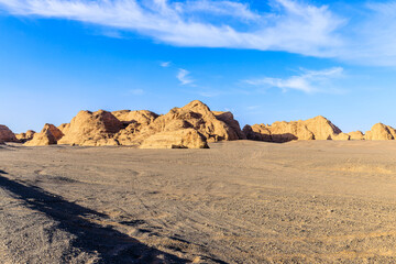 Beautiful natural landscape of the Yardang landform mountains in the desert under blue sky