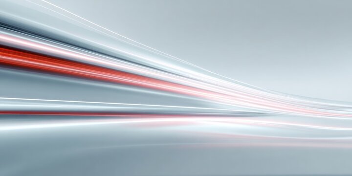 Sleek abstract background features glowing light trails moving rapidly across a smooth surface